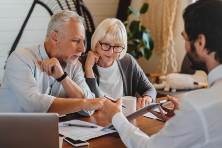 Elderly couple reviewing legal documents