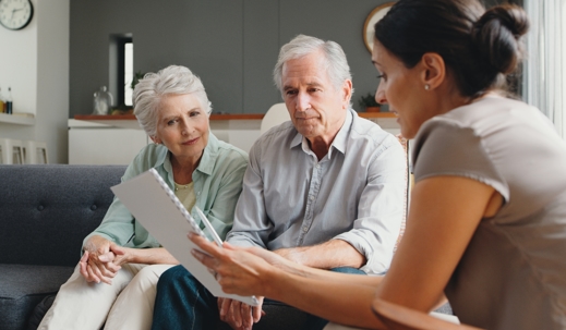 woman speaking with elderly couple