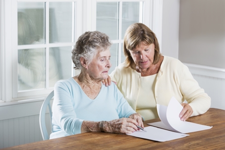 mother and daughter reviewing documents