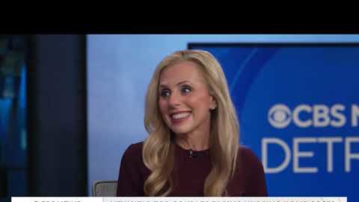 A blonde woman in a red top smiles in front of a CBS News Detroit logo. Text: NEW HELP FOR COUPLES FACING NURSING HOME COSTS, SOME MEDICAID BENEFITS MAY NOW BE USED.